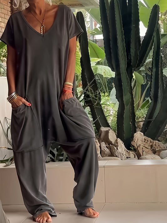A Women'S Loose-Fitting Romper with Pockets in a Single Color.